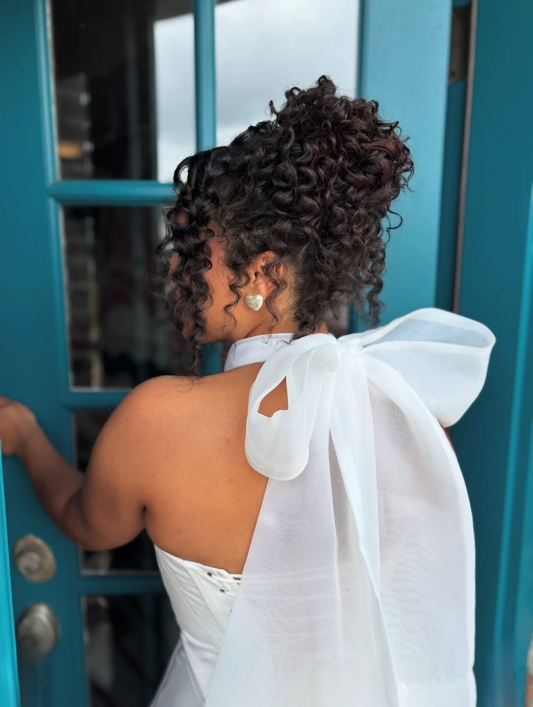 Bow-Kissed Curly Romance